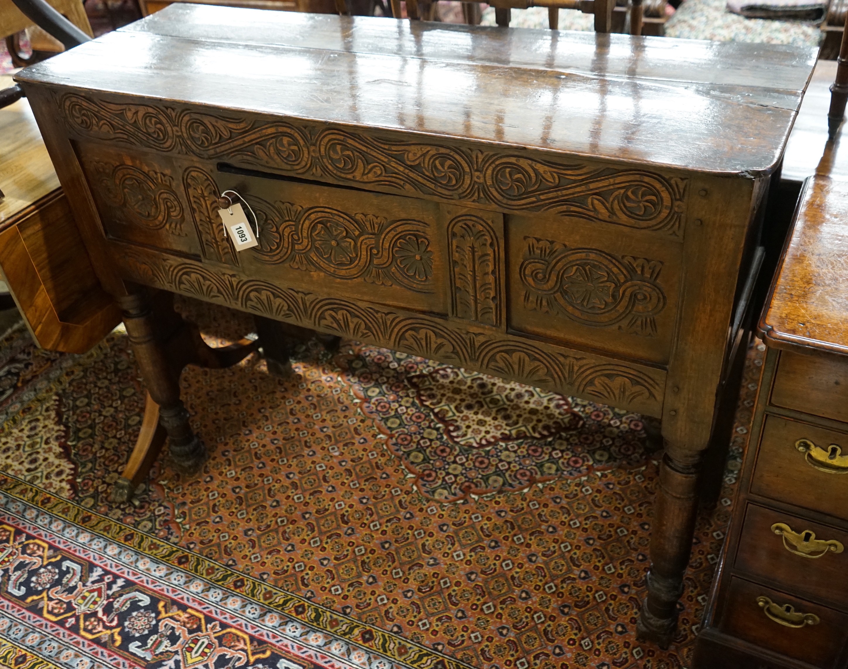An 18th century and later carved oak cabinet on stand, width 118cm, depth 42cm, height 96cm